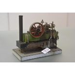 A live stationary steam plant, probably German, c. 1900, with spirit fired cylindrical boiler,