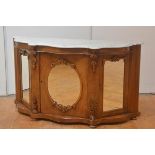 A mid-Victorian marble-topped mirror-inset walnut credenza, the white marble serpentine top over a