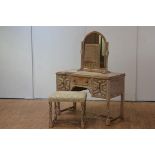 A limed oak dressing table, stool and toilet mirror, c. 1920, the dressing table with rectangular