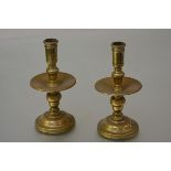 A pair of Dutch cast and turned brass candlesticks of "Heemskerk" type, with turned baluster stem