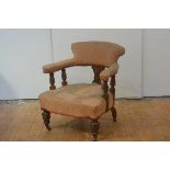 A Victorian walnut-framed drawing room chair, of horseshoe shape, the upholstered back over a