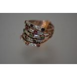 A gem-set stacking ring of five bands, each set with round brilliant-cut diamond points spaced by