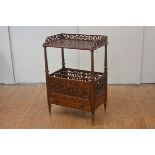 A large Victorian walnut whatnot canterbury, the rectangular top with pierced fretwork gallery,