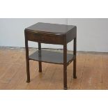 A mahogany bedside table, c. 1920, possibly Whytock & Reid, the rectangular bowfronted top over a