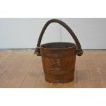 A copper and brass bound coopered oak bucket, c. 1900, printed with the Royal Coat of Arms, one of