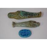 Two Egyptian turquoise glazed faience shabti; together with a turquoise glazed scarab seal with
