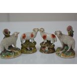 Two pairs of 19th century Staffordshire sheep models: the large pair with shredded coats and spill-