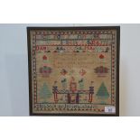 A late 19th century needlework sampler, Elisabeth Anderson, aged 11, worked in colours with