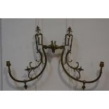 A pair of late Victorian brass wall lights, (converted from gas fittings), each with circular