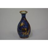 A small Wedgwood dragon lustre vase, c. 1920, of baluster form, decorated with dragons and