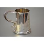 A George VI silver tankard, London 1947, in 18th century style, of tapering cylindrical form, with