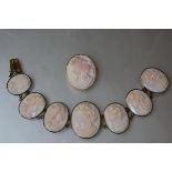 A late 19th century shell cameo bracelet, composed of seven graduated plaques, each carved with a