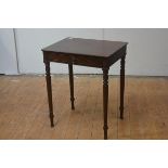 A small Regency mahogany side table, the rectangular top over a frieze drawer, raised on ring and