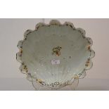 A 19th century Continental faience shell-form wash bowl, decorated to the well and scalloped rim