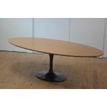 Julian Chichester, a Dakota dining table, the oval top raised on a black lacquered tulip base.