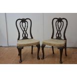 A pair of Edwardian mahogany side chairs in George II style, each with shell-carved crest rail