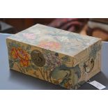A Chinese painted pigskin box, c. 1900, boldly decorated with flowers and blossom, with