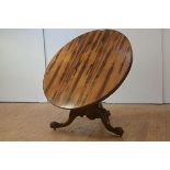 A striking calamander and walnut tilt-top supper table, mid-19th century, the boldly figured