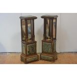 A pair of marble-topped, gilt-metal mounted and mirror-backed mahogany stands in the Empire taste,