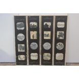 Four framed sets of Chinese dream stone panels, early 20th century, each frame enclosing four panels