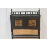 An Aesthetic Movement ebonised hanging wall cabinet, c. 1880, the rectangular galleried top above