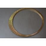 A 9ct gold fringe collar necklace, of graduated plaques, cased. 41cm, 26 grams