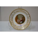 A Paris porcelain plate, late 18th century, painted to the well with a mother feeding a child, the