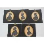 A group of five early 19th century silhouette portraits, two ladies and three gentlemen, each