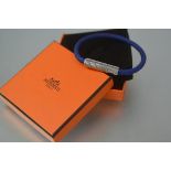 Hermes, a Goliath code bracelet, in blue plaited leather with palladium plated clasp, boxed, with