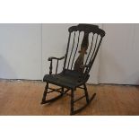 A late 19th century stick-back rocking chair, probably American, unusually decorated with japanned