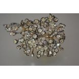 A striking large diamond spray brooch, late 19th century, the central floral spray mounted en