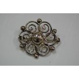 A Hermann Siersbol Danish sterling silver brooch, c. 1950, of circular form, deccorated with spheres
