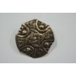 A sterling silver shield-form brooch, chased with Celtic knotwork, stamped "sterling silver".