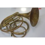 A brass French horn by Hawkes & Son, Makers Denman Street, Picadilly Circus, London, registration