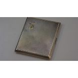 A Birmingham silver engine-turned cigarette case with a yellow and rose metal tulip motif. 139