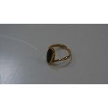 A 9ct gold green stone-set dress ring. 5 grams