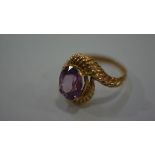 A Continental 14ct gold scroll ring set pink topaz, size P (5g)