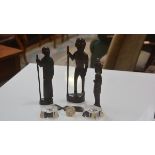 A group of three carved African wood figures and carved hardwood comb, a pair of crystal salts and a