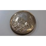 A Continental white metal cased compact with mirrored interior, with Indian boy, elephant and dog