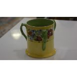 A Bough Pottery loving cup with handpainted floral decoration to border, impressed verso, Loving