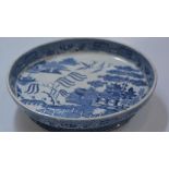 A 19th century pottery blue and white transfer printed serving bowl, Three Men on a Bridge