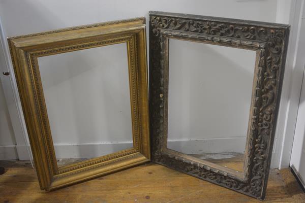 A carved Rococo style rectangular composition frame with distressed finish ( 59cm by 41cm) and a