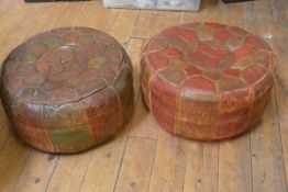 Two 1950's/60's leather pouffes (leather with distressed finish). Each 25cm by c. 50cm (2)