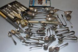 A large collection of Epns flatware including teaspoons, jam spoons, coffee spoons, sugar nips,