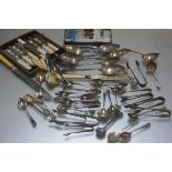 A large collection of Epns flatware including teaspoons, jam spoons, coffee spoons, sugar nips,