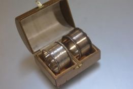 A domed casket with velvet lined interior, a Birmingham silver engine turned napkin ring and a white