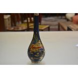 A Royal Cauldon Blue Lagoon pattern slim neck baluster vase decorated with seated figure in a canoe,