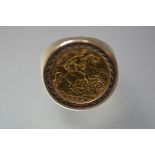 An Edward VII gold half sovereign mounted in a yellow metal ring with rubover setting. Size S/T,