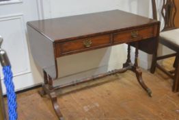 A reproduction mahogany sofa table, the rectangular top with twin drop flaps, fitted two frieze