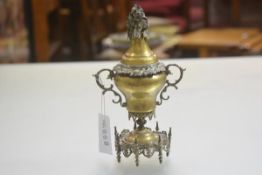 An Indian brass and white metal mounted hinged two handled urn with rose leaf and flowerhead